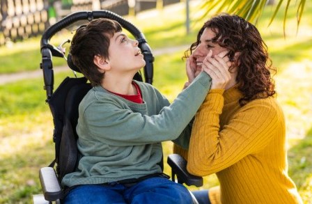 A child and parent sharing a close moment outdoors