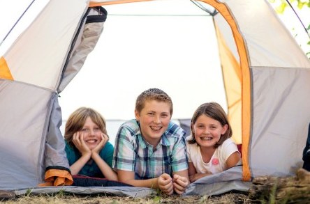 Children enjoying a camping experience together