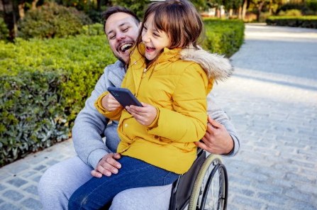 A child and parent enjoying time together outdoors